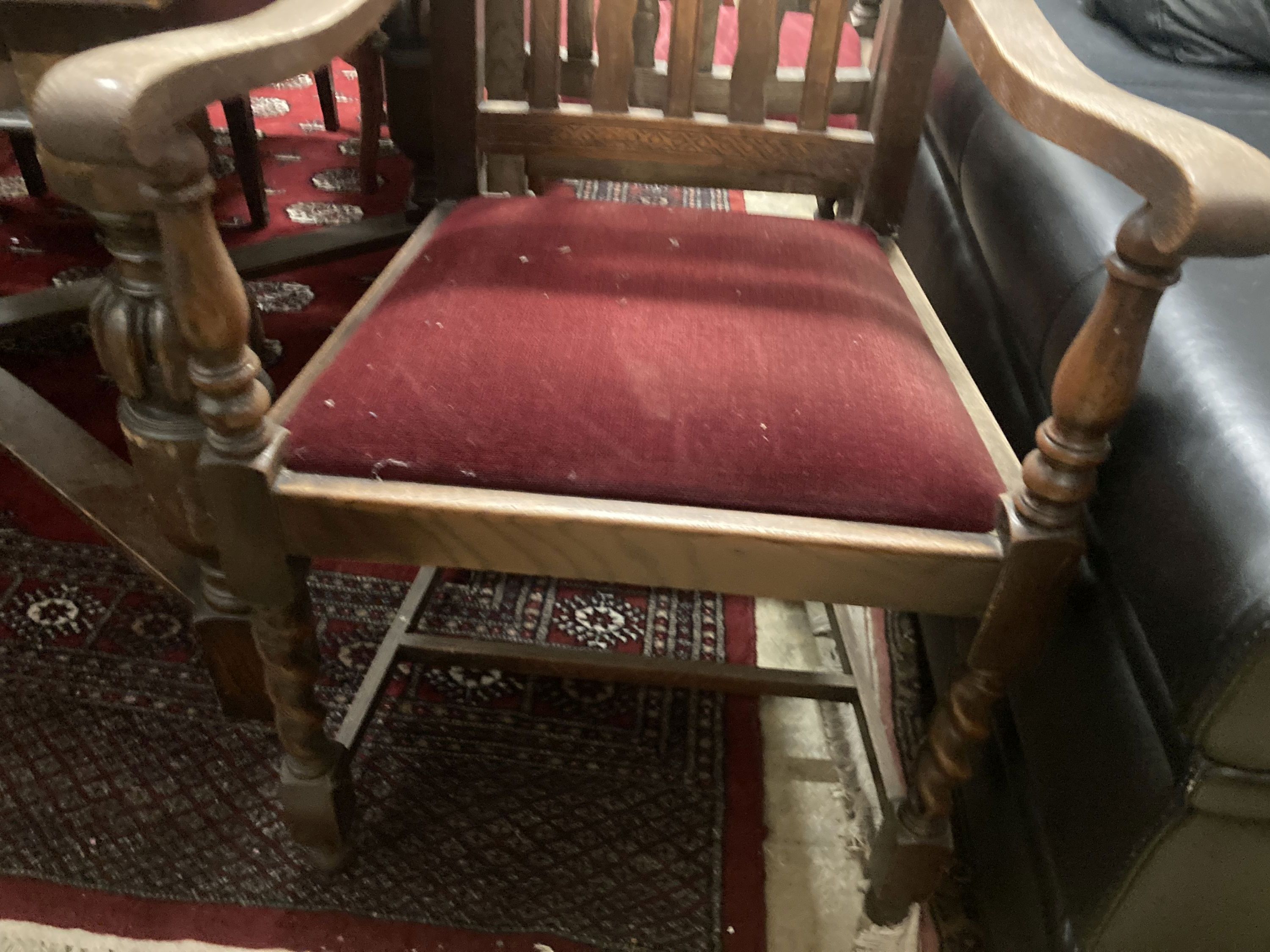 A set of six 1920s oak Carolean style dining chairs (two with arms) and an oak draw leaf dining table, width 137cm, depth 106cm, heigh